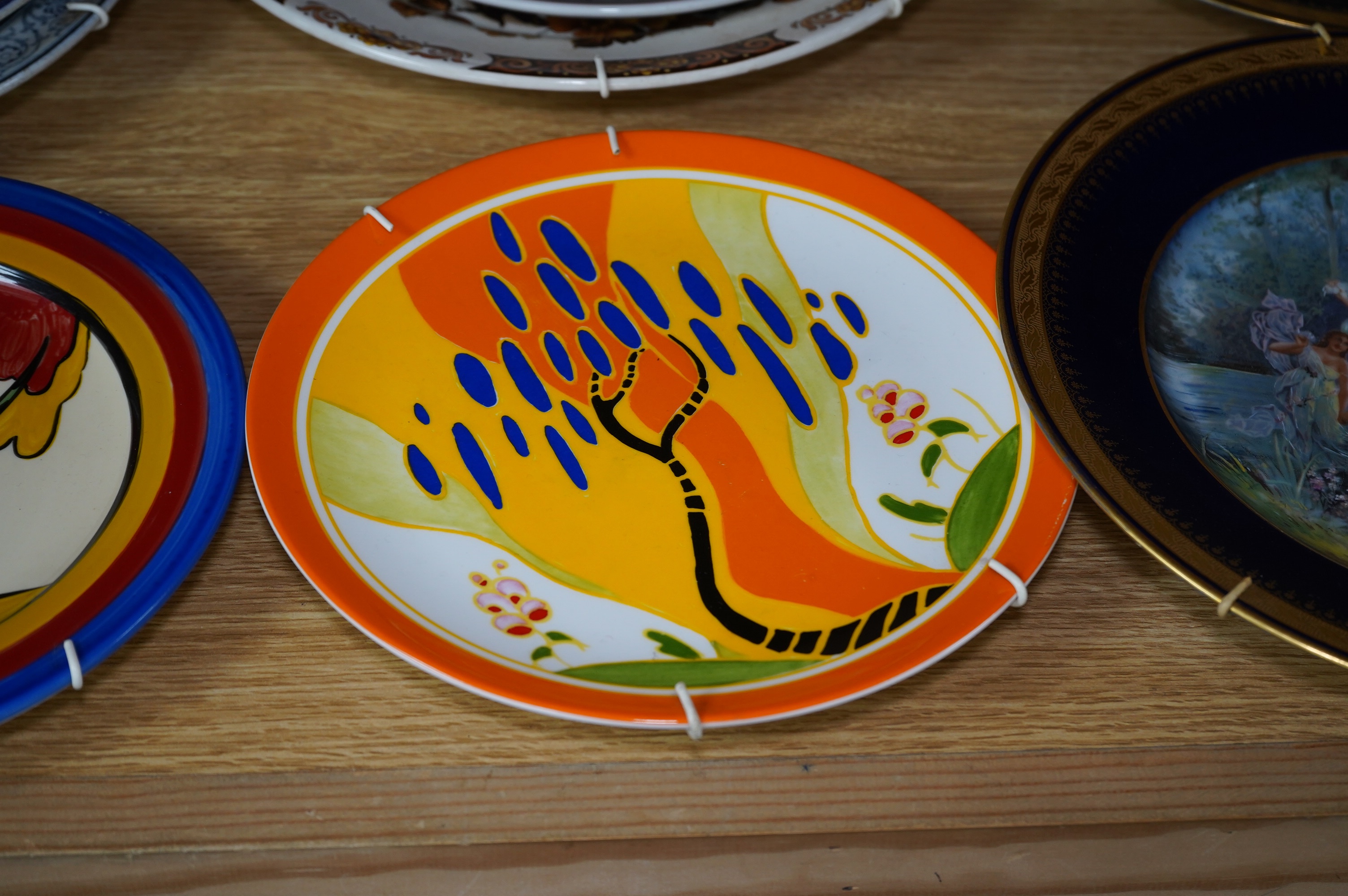 Nine various decorative wall plates including a Wedgwood limited edition ‘Windbells’ in the Bizarre living landscapes of Clarice Cliff plate, Chelsea Works Burslem, Limoges etc. Condition - mostly fair to good